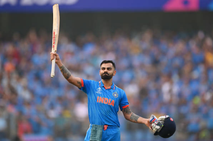 Virat Kohli of India celebrates after scoring a century